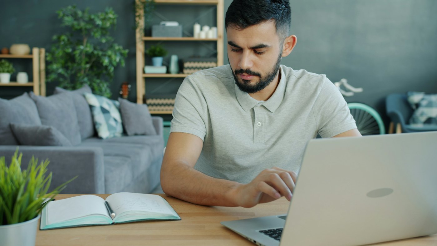A dentist watching a Tomorrow Tooth online course at home